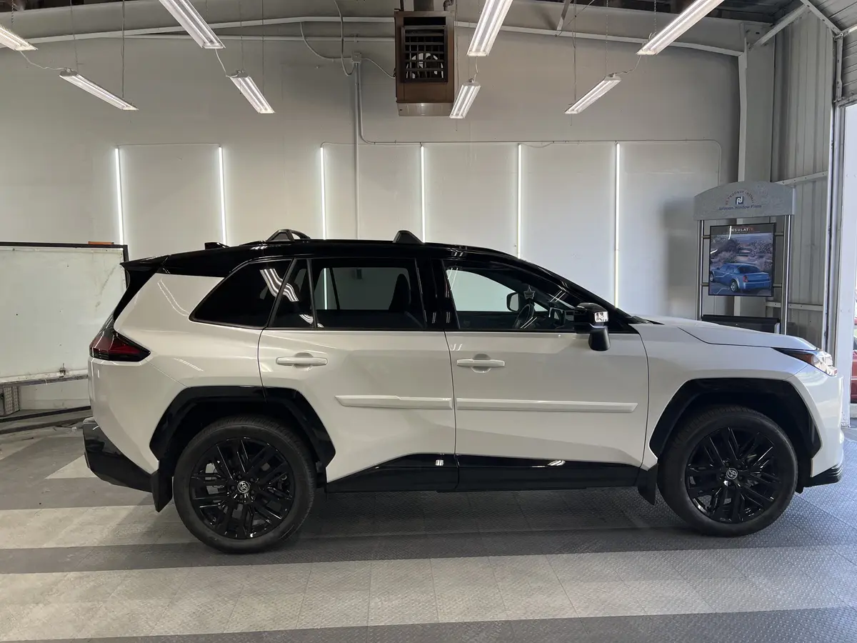 White Toyota RAV4 before window tinting, factory glass (view 3)