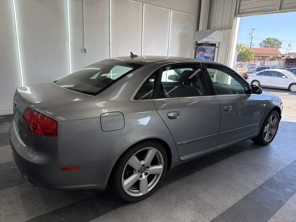 Silver Audi A4 before window tinting, factory glass (view 3)