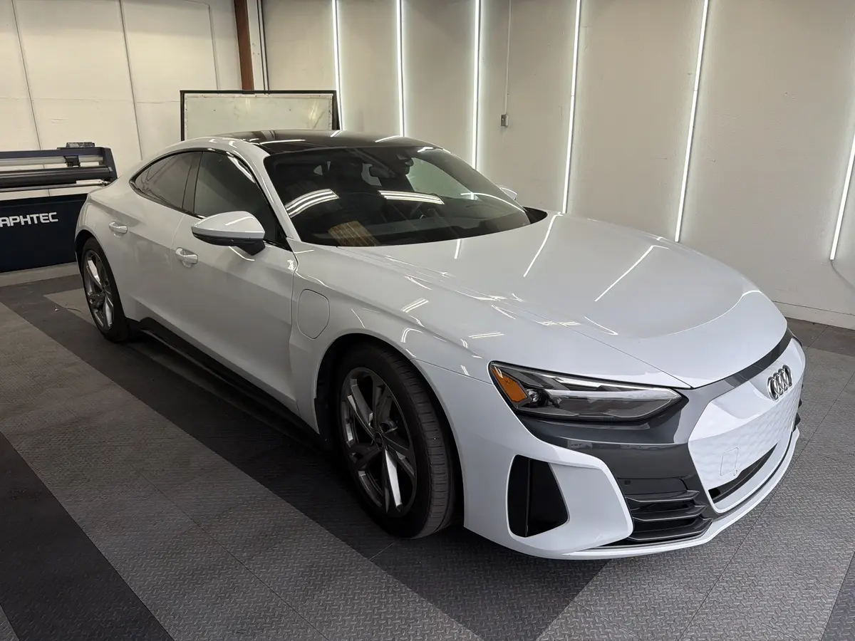 White Audi e-tron GT before window tinting, factory glass (view 1)