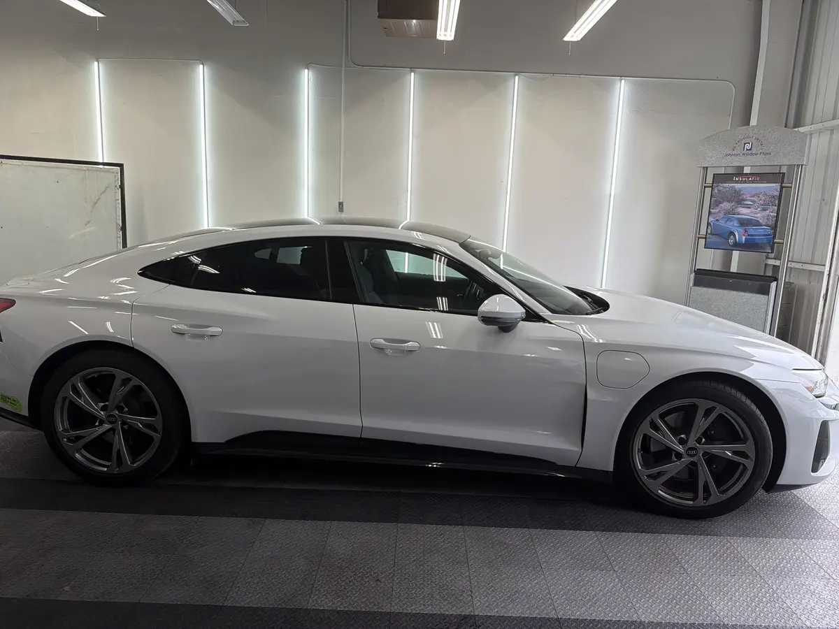 White Audi e-tron GT before window tinting, factory glass (view 2)