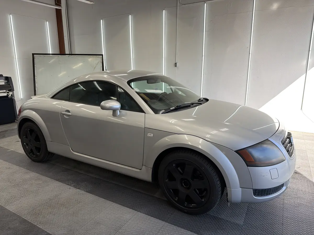 Silver Audi TT before window tinting, factory glass (view 1)