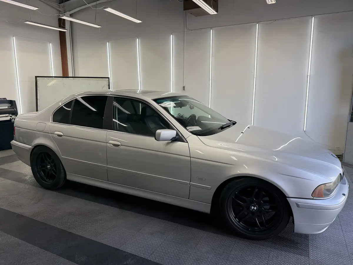 Silver BMW 5 Series after Avery Dennison Encore Supreme ceramic window tint (view 2)