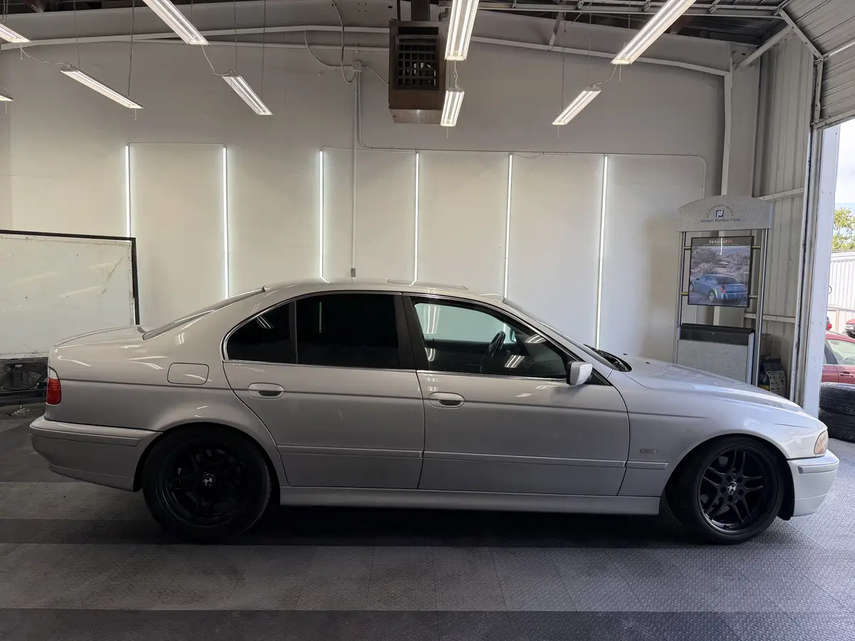 Silver BMW 5 Series after Avery Dennison Encore Supreme ceramic window tint (view 3)