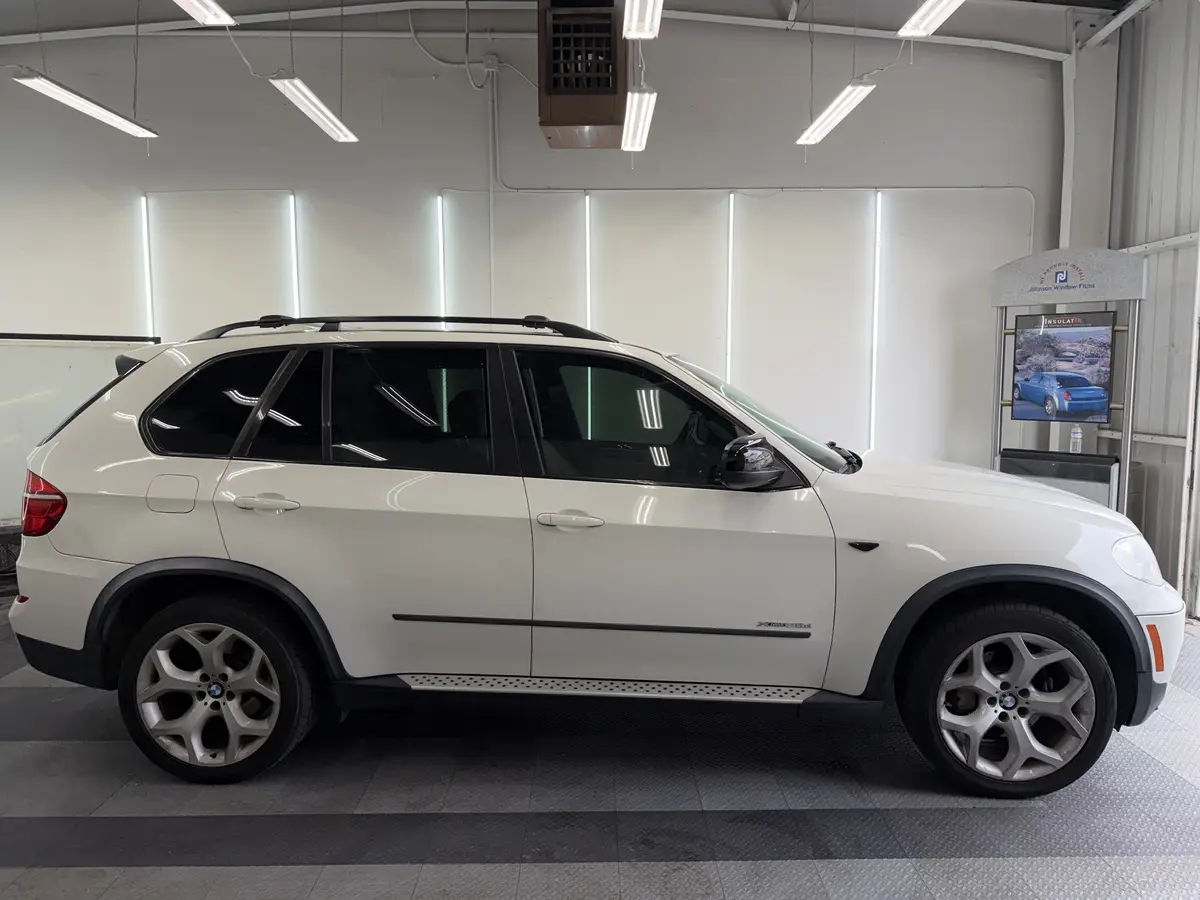 White BMW X5 after Avery Dennison Encore Supreme ceramic window tint (view 1)
