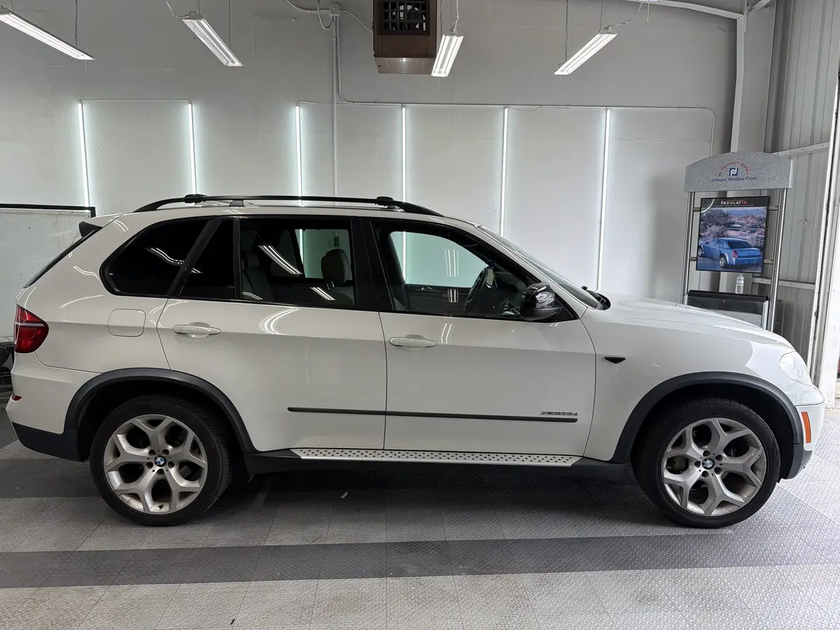 White BMW X5 before window tinting, factory glass (view 1)