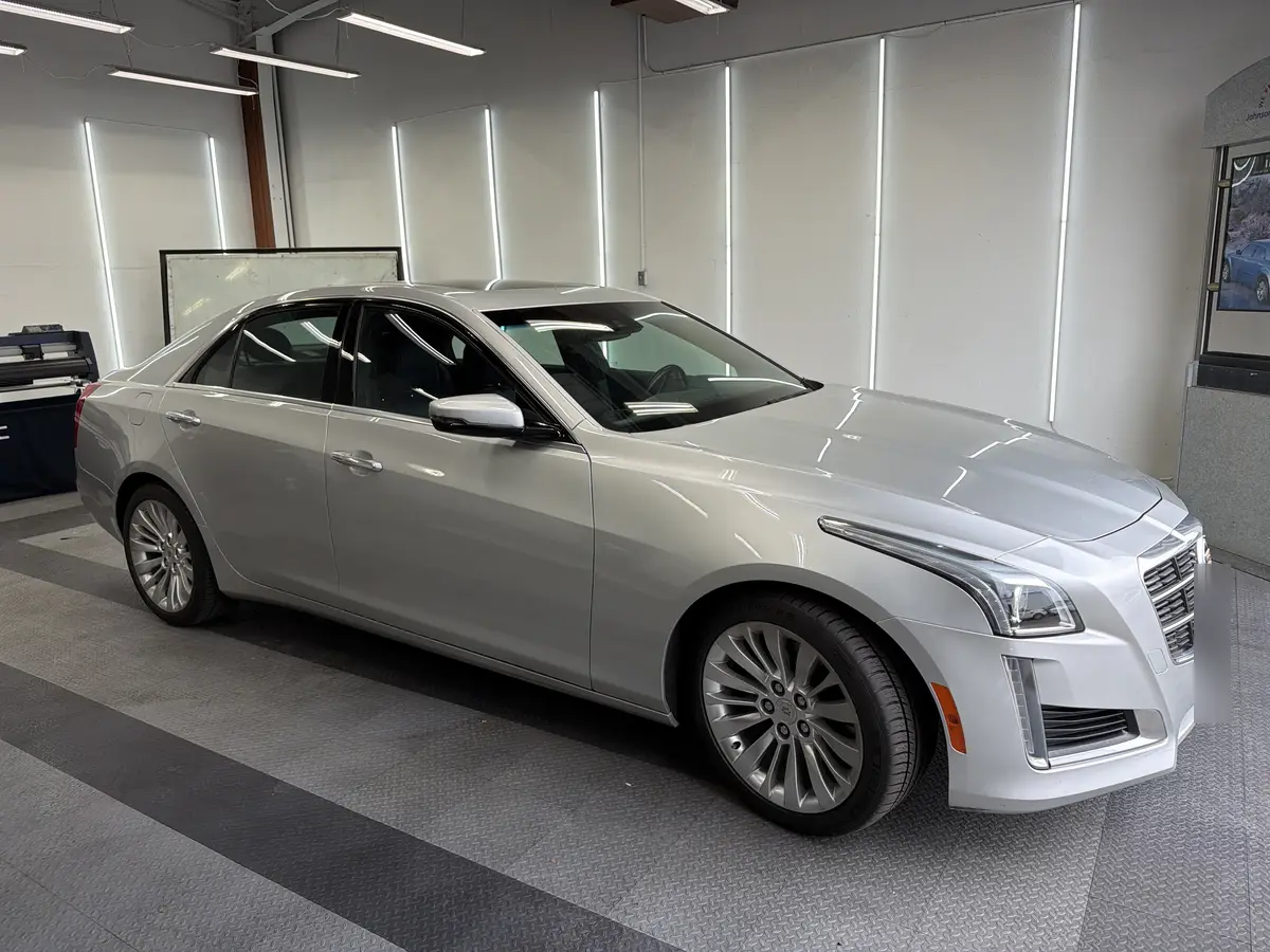 Silver Cadillac CTS before window tinting, factory glass (view 1)