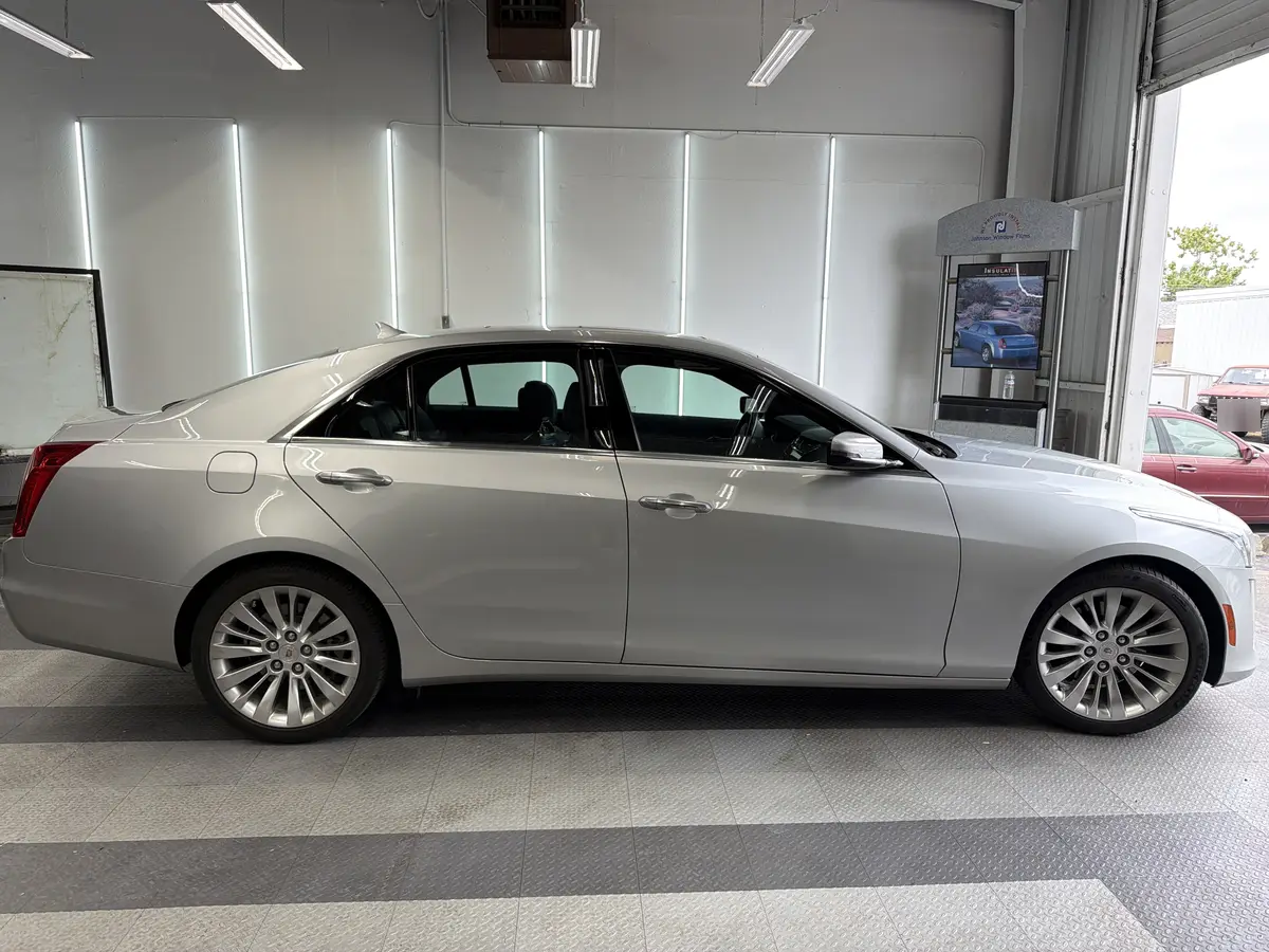Silver Cadillac CTS before window tinting, factory glass (view 2)