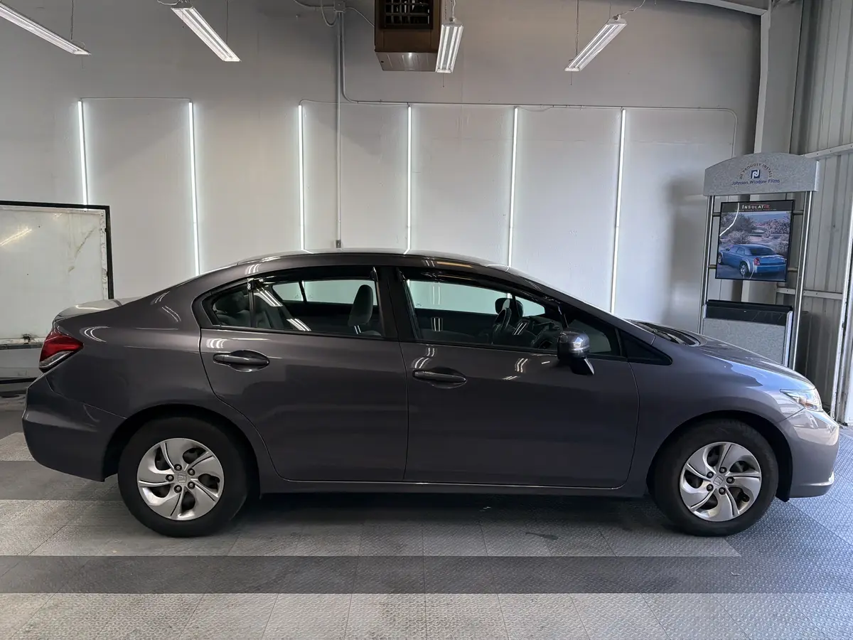Gray Honda Civic before window tinting, factory glass (view 2)