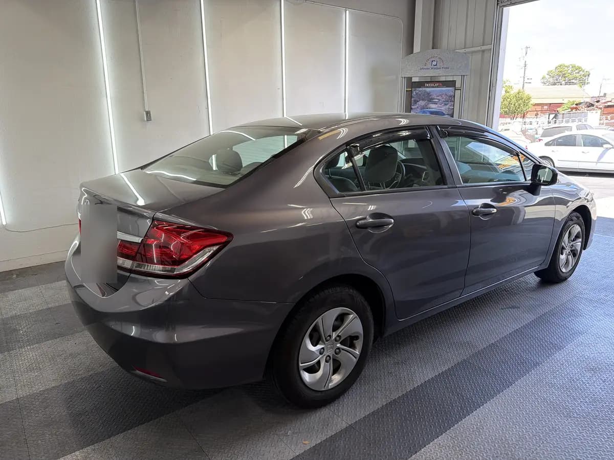 Gray Honda Civic before window tinting, factory glass (view 3)