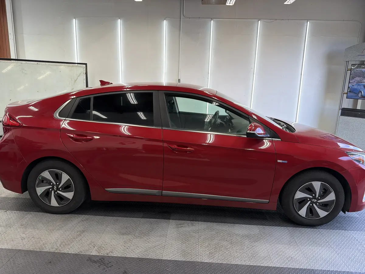 Red Hyundai Ioniq after Avery Dennison Encore Supreme ceramic window tint (view 1)