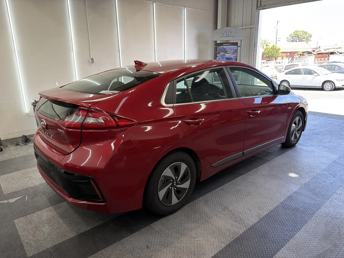 Red Hyundai Ioniq before window tinting, factory glass (view 2)