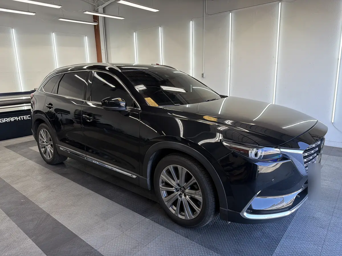 Black Mazda CX-9 at Quality Window Tinting, ceramic window tint job (photo 1)