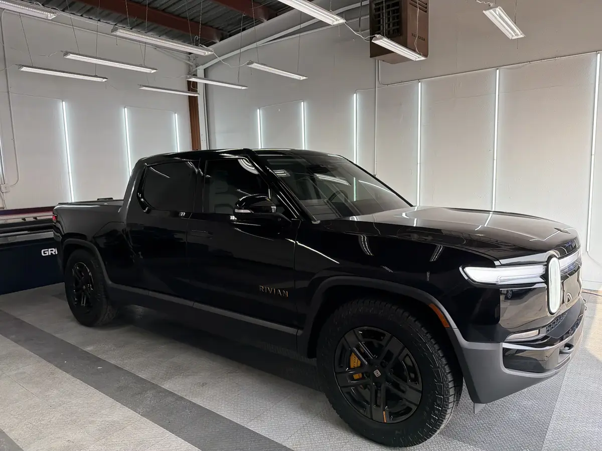 Black Rivian R1T at Quality Window Tinting, ir ceramic window tint job (photo 1)