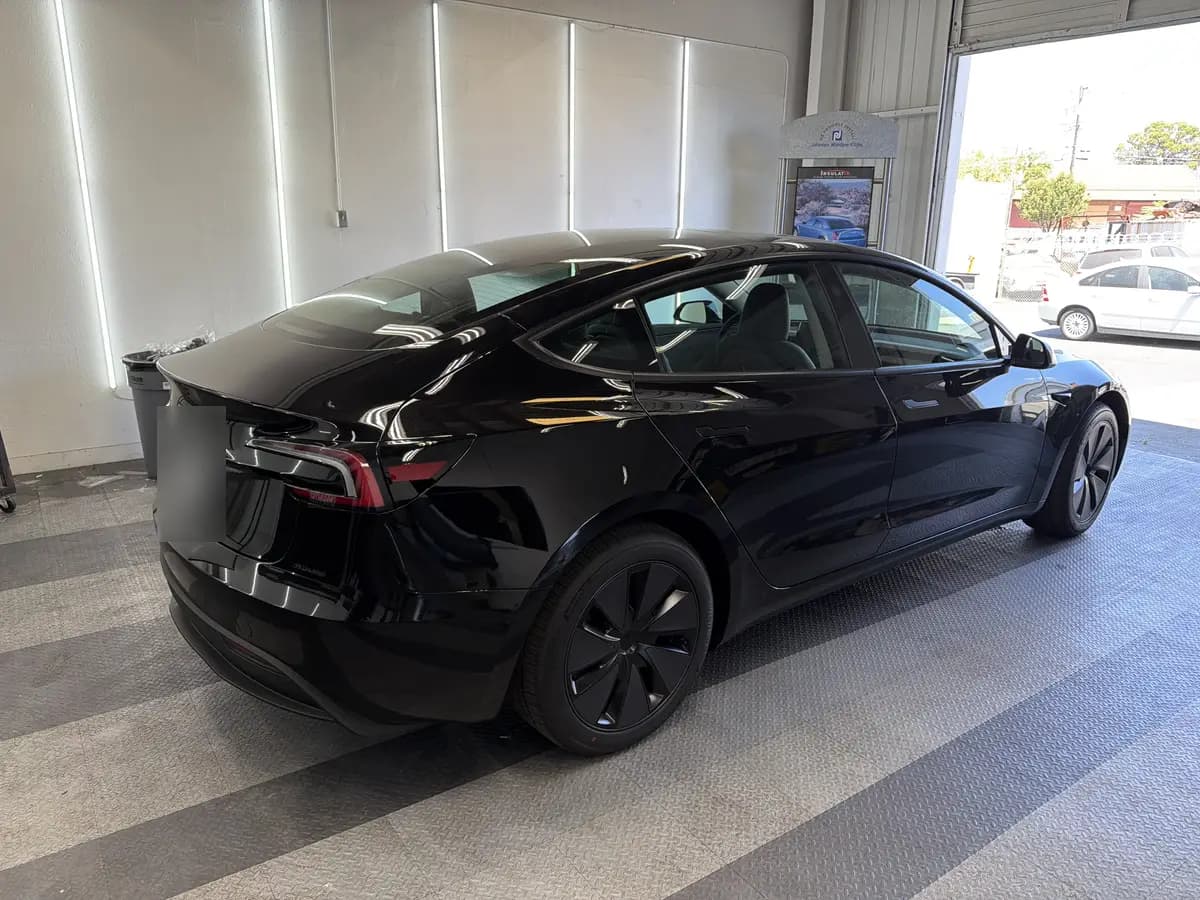 Black Tesla Model 3 before window tinting, factory glass (view 3)