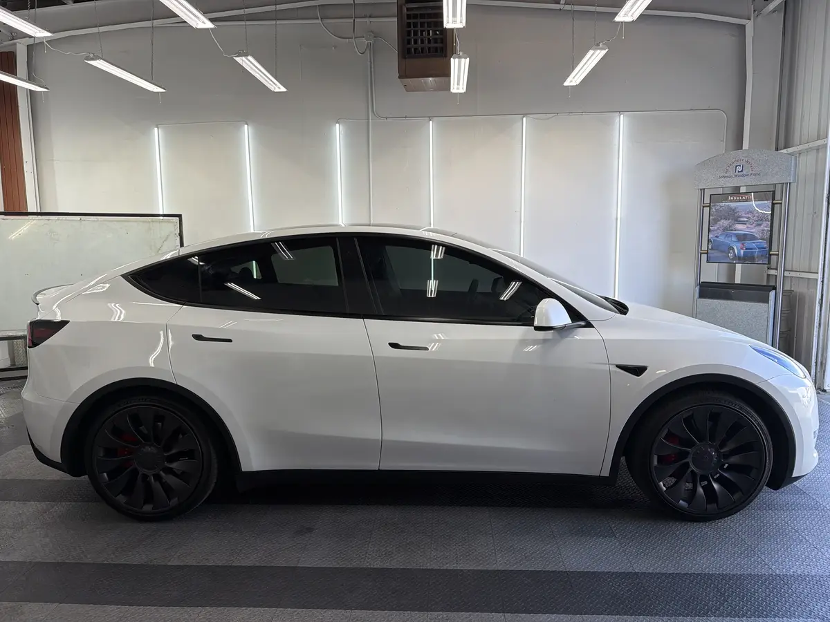 White Tesla Model Y after Avery Dennison Encore Supreme ceramic window tint (view 2)