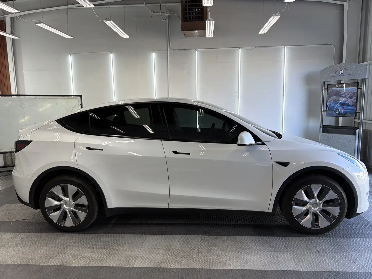 White Tesla Model Y after Avery Dennison Encore Supreme ceramic window tint (view 2)