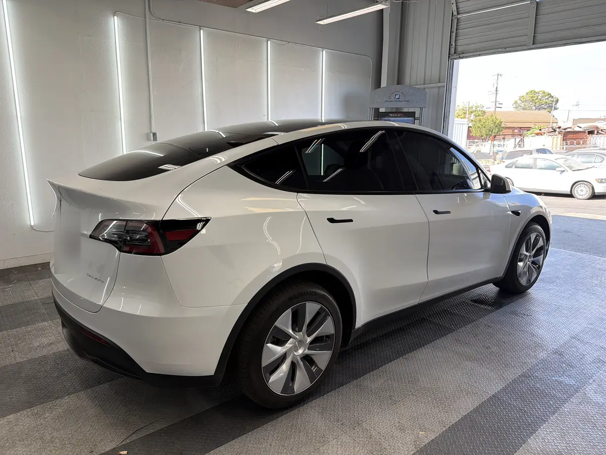 White Tesla Model Y after Avery Dennison Encore Supreme ceramic window tint (view 3)