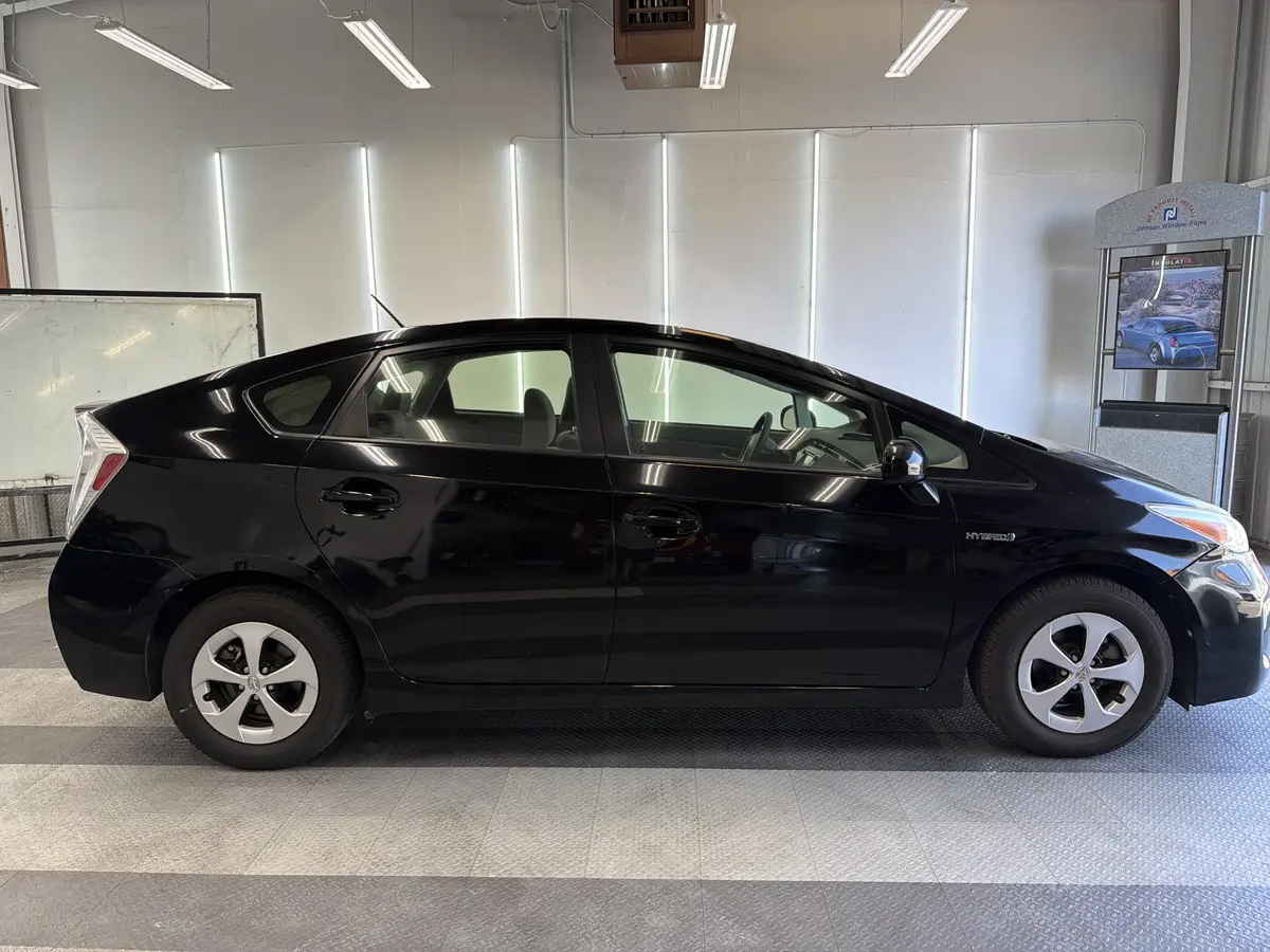 Black Toyota Prius before window tinting, factory glass (view 2)
