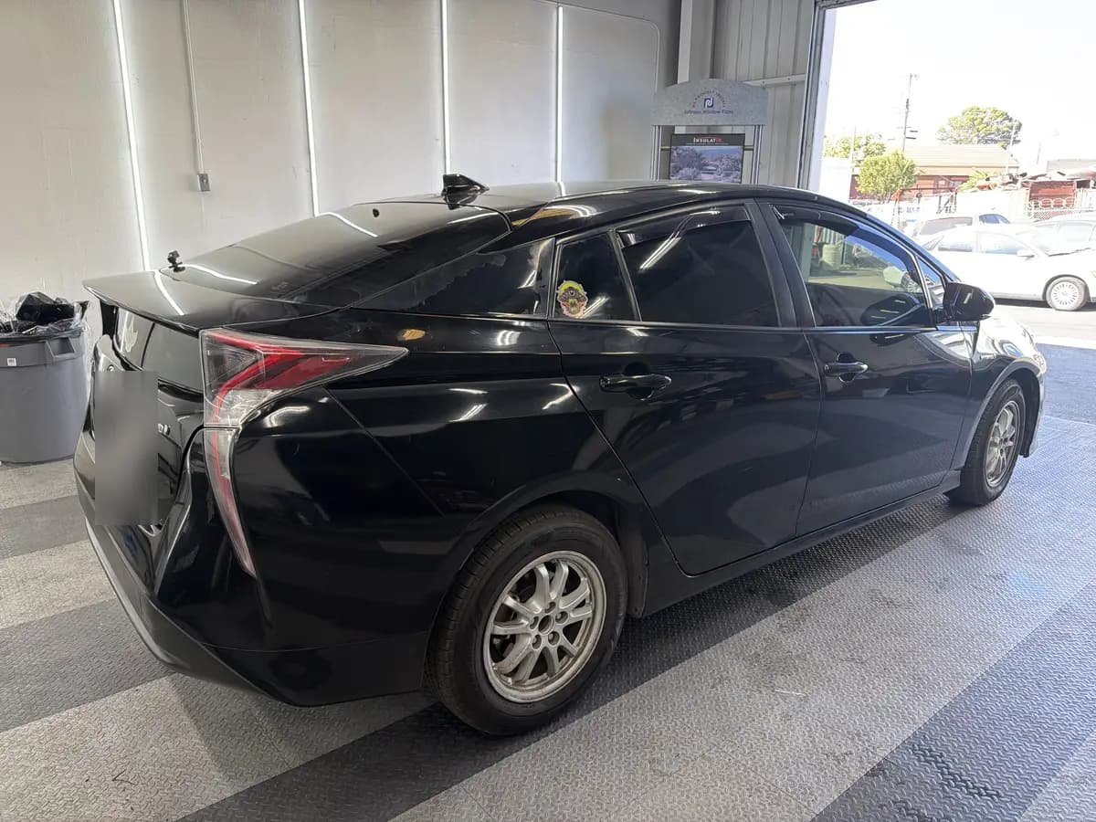 Black Toyota Prius after Avery Dennison Encore carbon window tint (view 1)