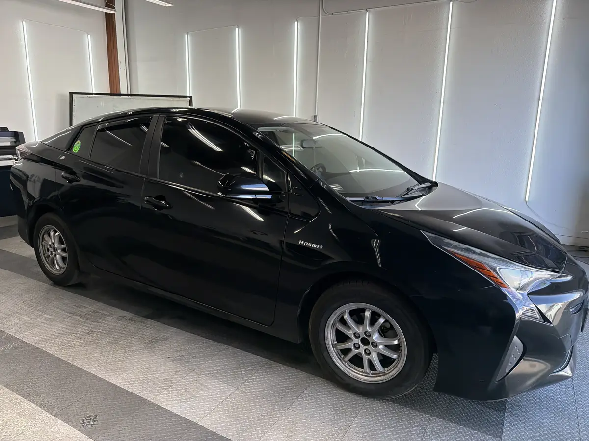 Black Toyota Prius after Avery Dennison Encore carbon window tint (view 2)