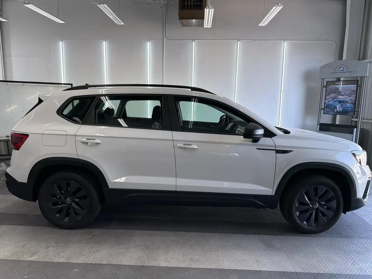 White Volkswagen Taos before window tinting, factory glass (view 2)