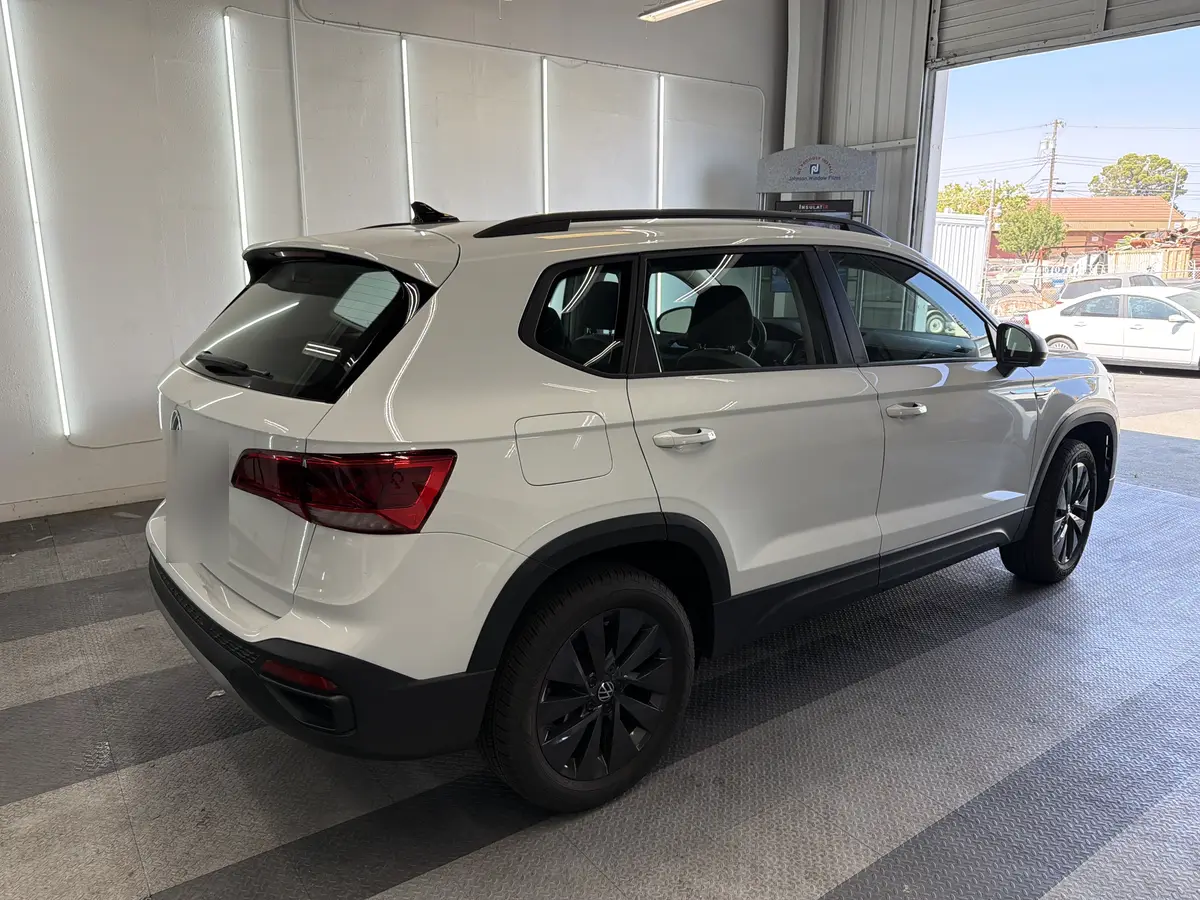 White Volkswagen Taos before window tinting, factory glass (view 3)