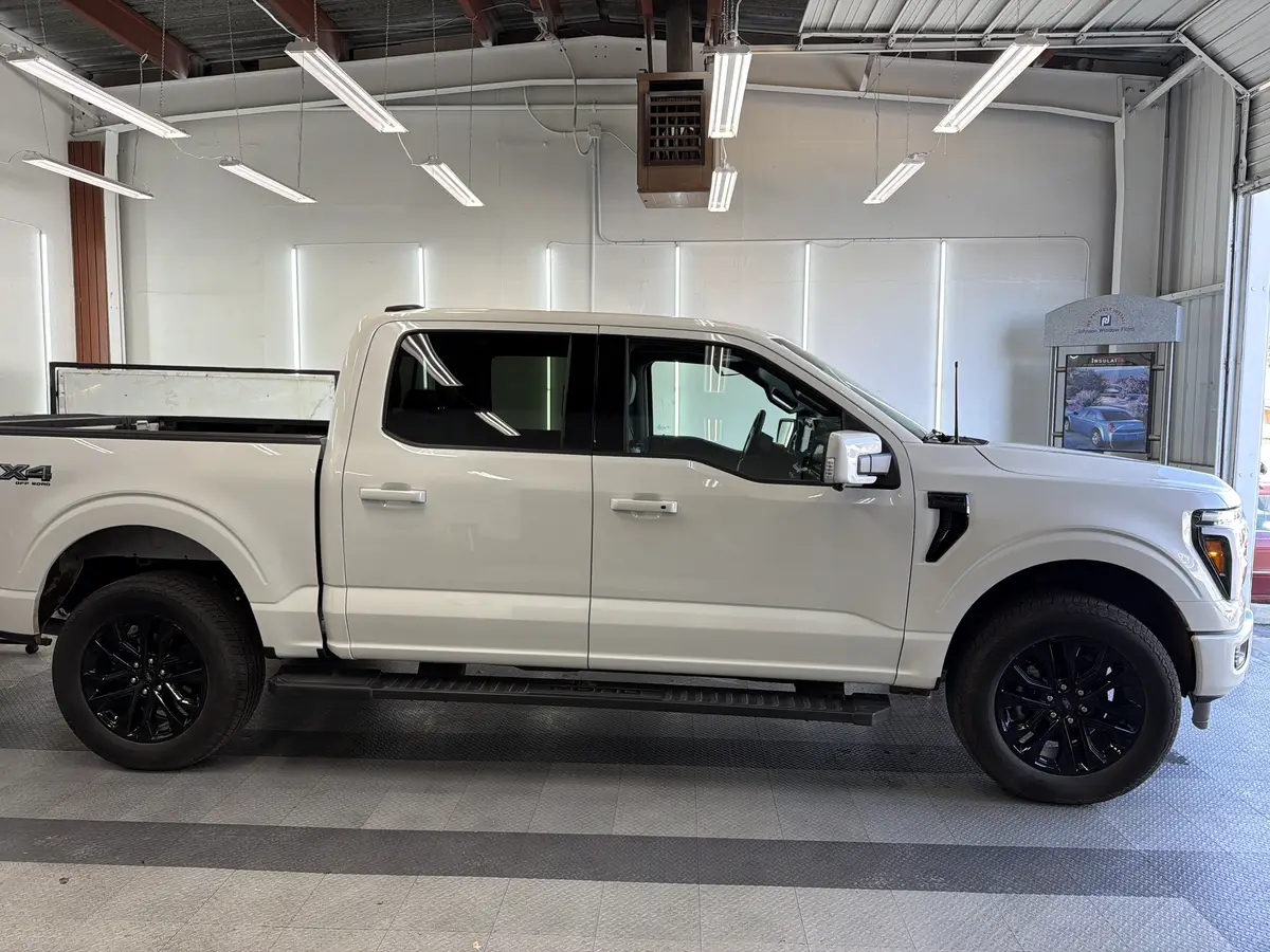White Ford F-150 before window tinting, factory glass (view 2)