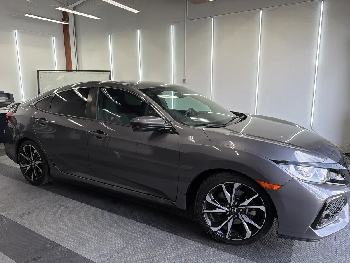 Gray Honda Civic after Avery Dennison Encore carbon window tint (view 1)