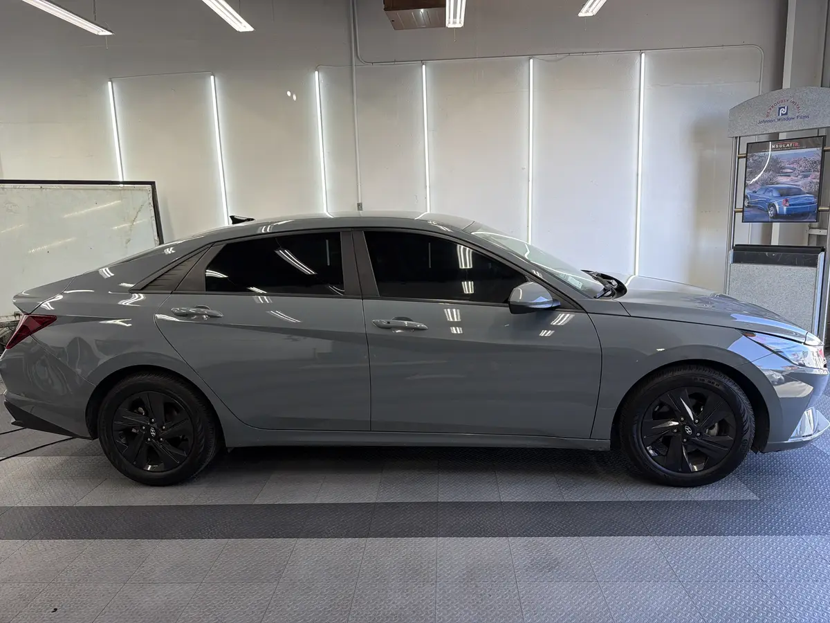 Gray Hyundai Elantra after Avery Dennison Encore carbon window tint (view 1)