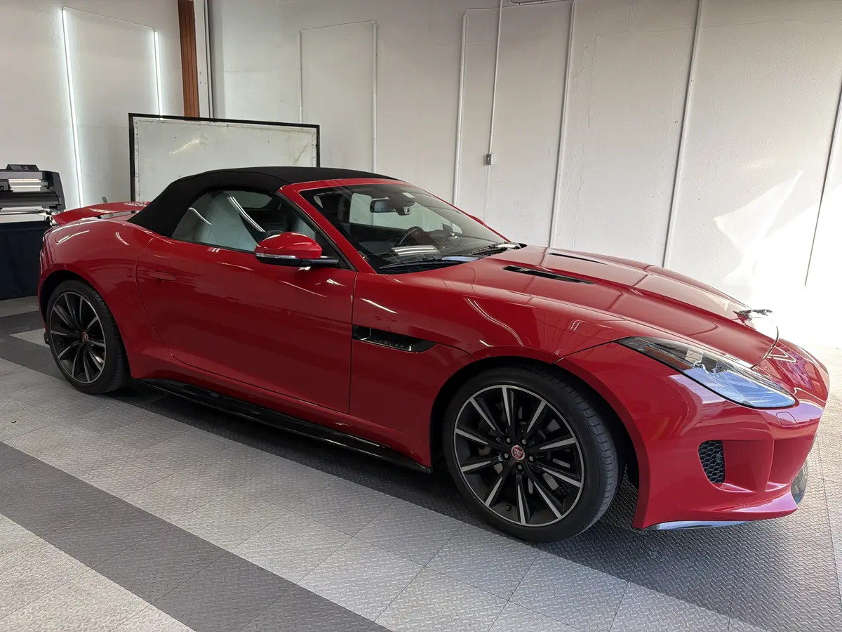Red Jaguar F-Type before window tinting, factory glass (view 1)
