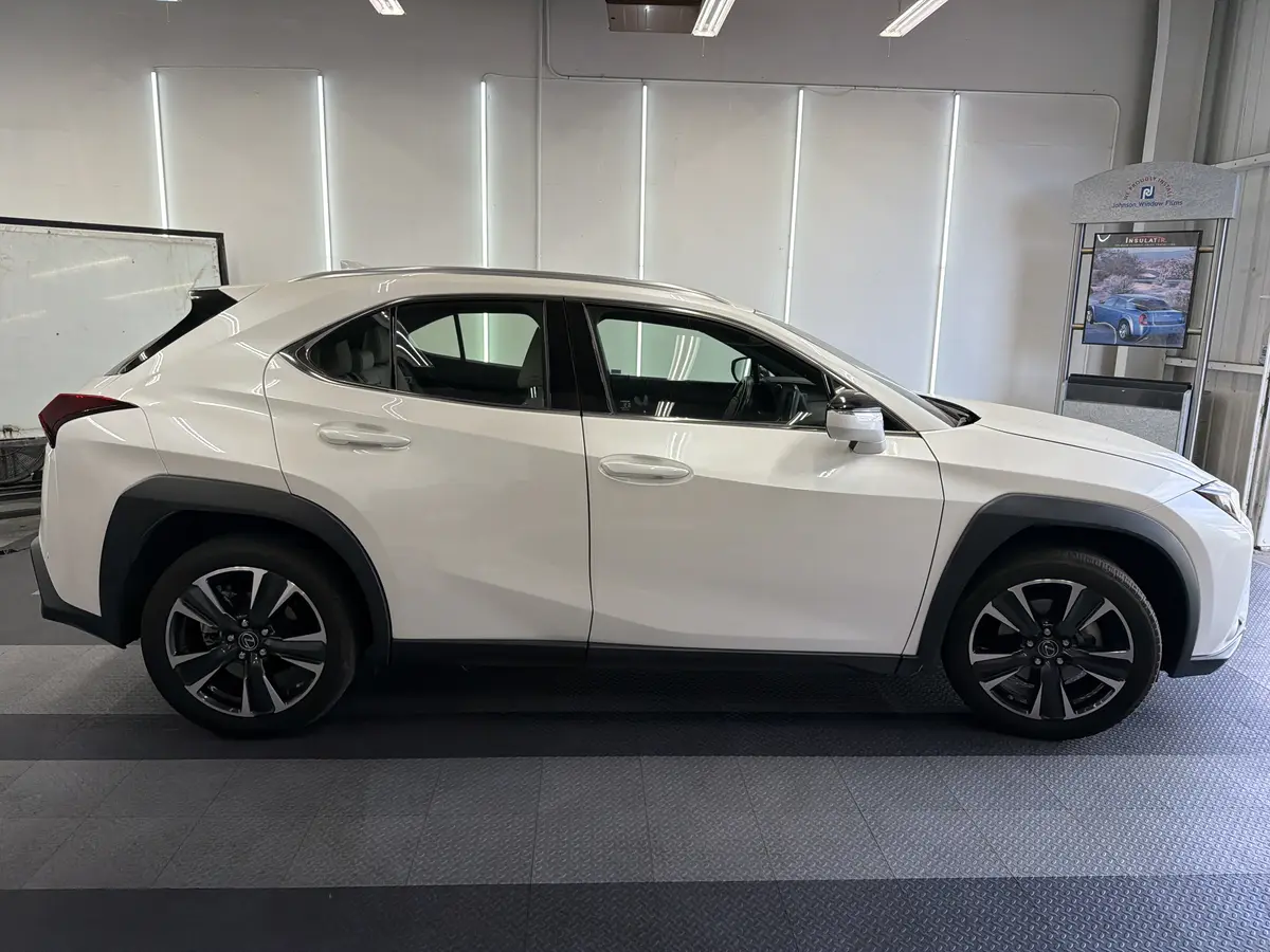 White Lexus UX before window tinting, factory glass (view 2)