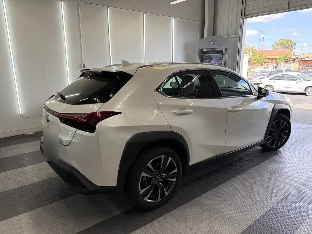 White Lexus UX before window tinting, factory glass (view 3)