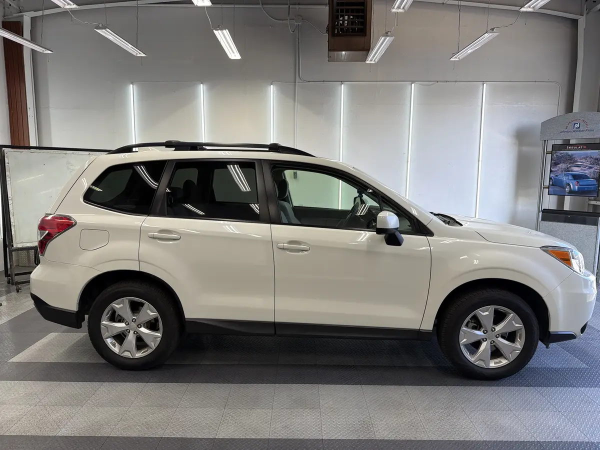 White Subaru Forester before window tinting, factory glass (view 2)