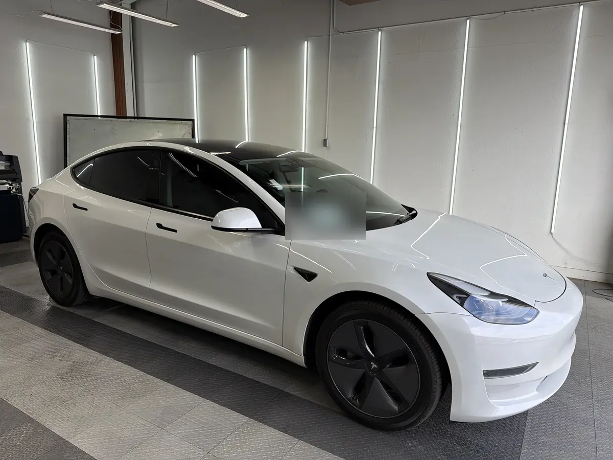 White Tesla Model 3 after Avery Dennison Encore Supreme ceramic window tint (view 1)