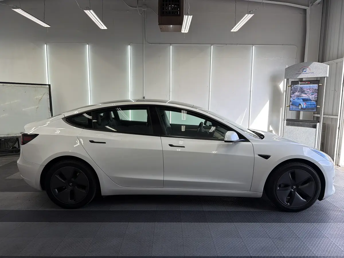 White Tesla Model 3 before window tinting, factory glass (view 2)