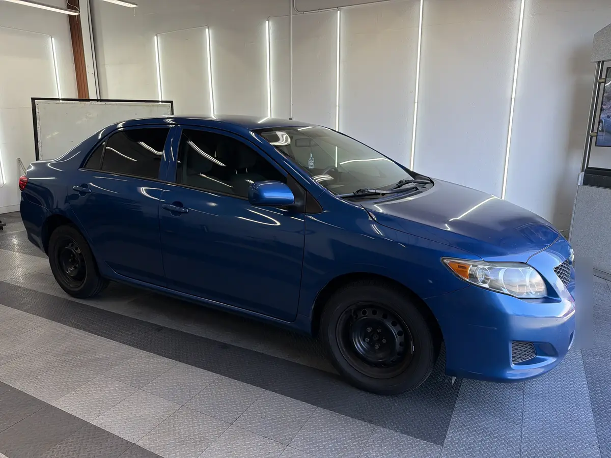 Blue Toyota Corolla after Avery Dennison Encore Supreme ceramic window tint (view 1)