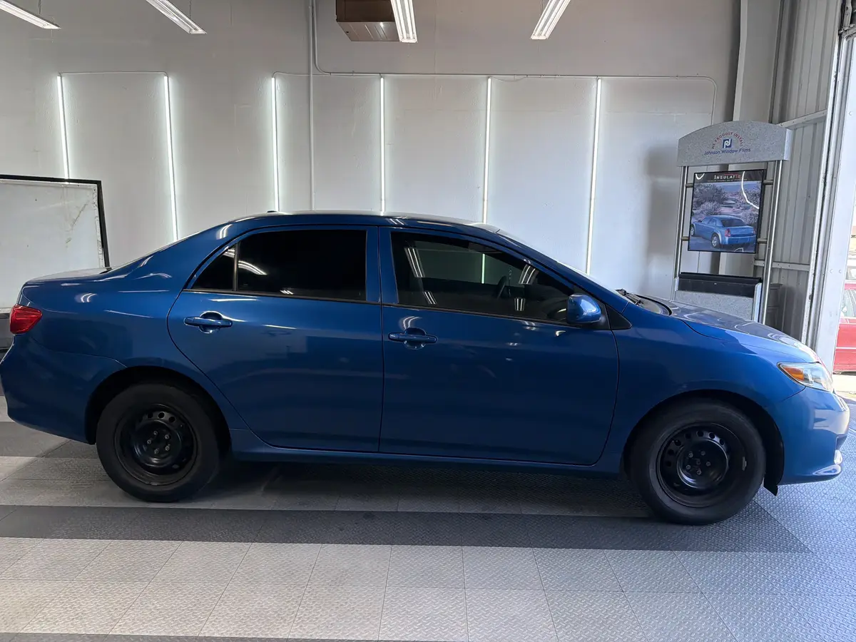 Blue Toyota Corolla after Avery Dennison Encore Supreme ceramic window tint (view 2)