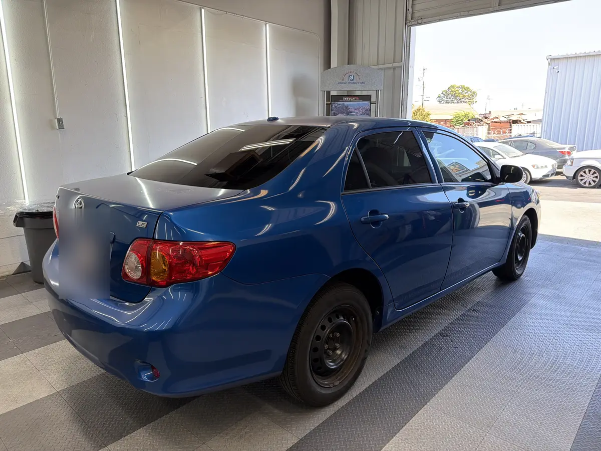 Blue Toyota Corolla after Avery Dennison Encore Supreme ceramic window tint (view 3)