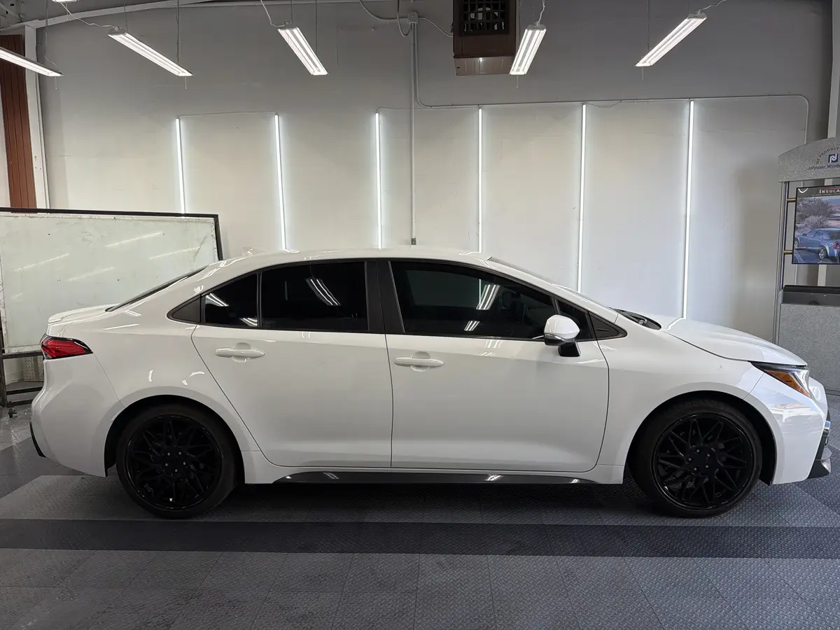 White Toyota Corolla after Avery Dennison Encore carbon window tint (view 2)