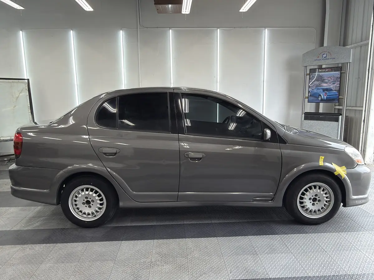 Gray Toyota Echo after Avery Dennison Encore carbon window tint (view 2)