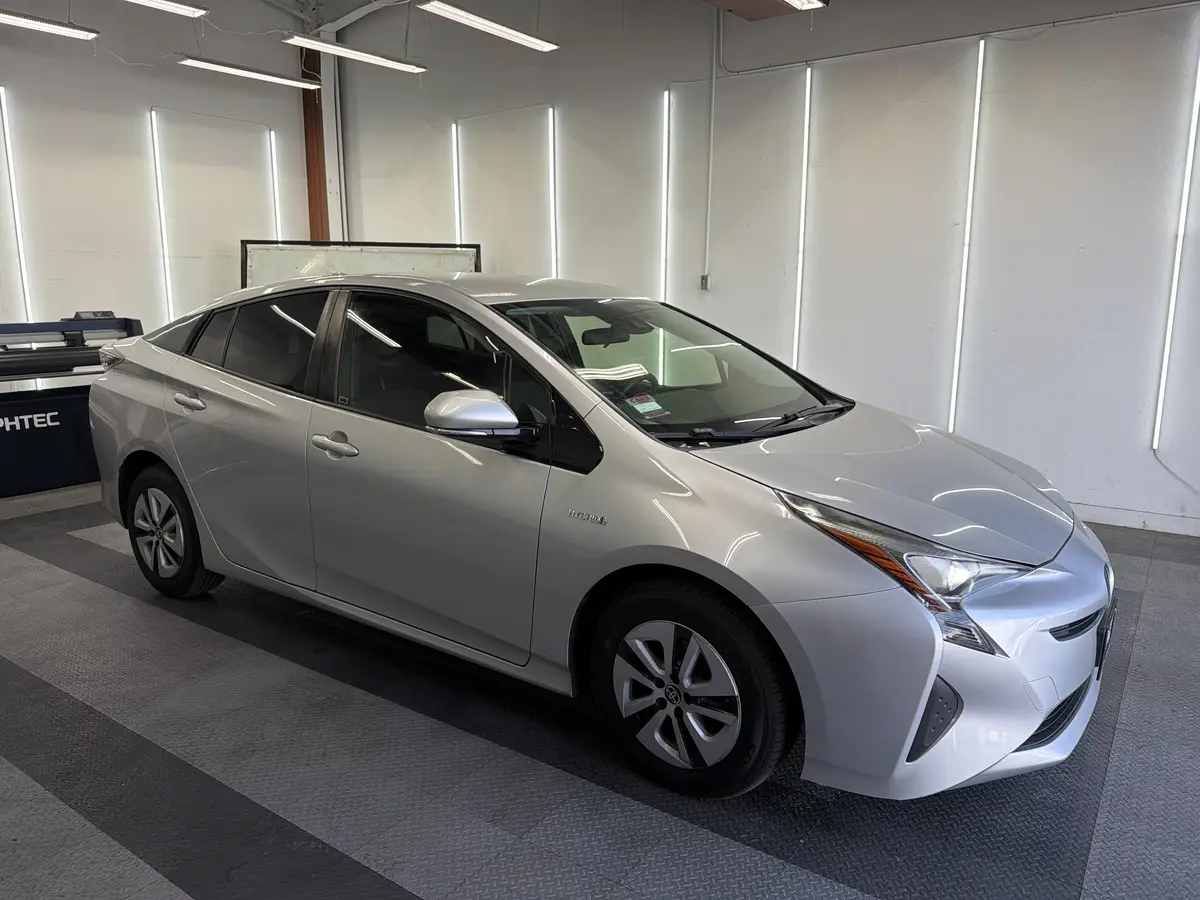 Silver Toyota Prius after Avery Dennison Encore carbon window tint (view 1)