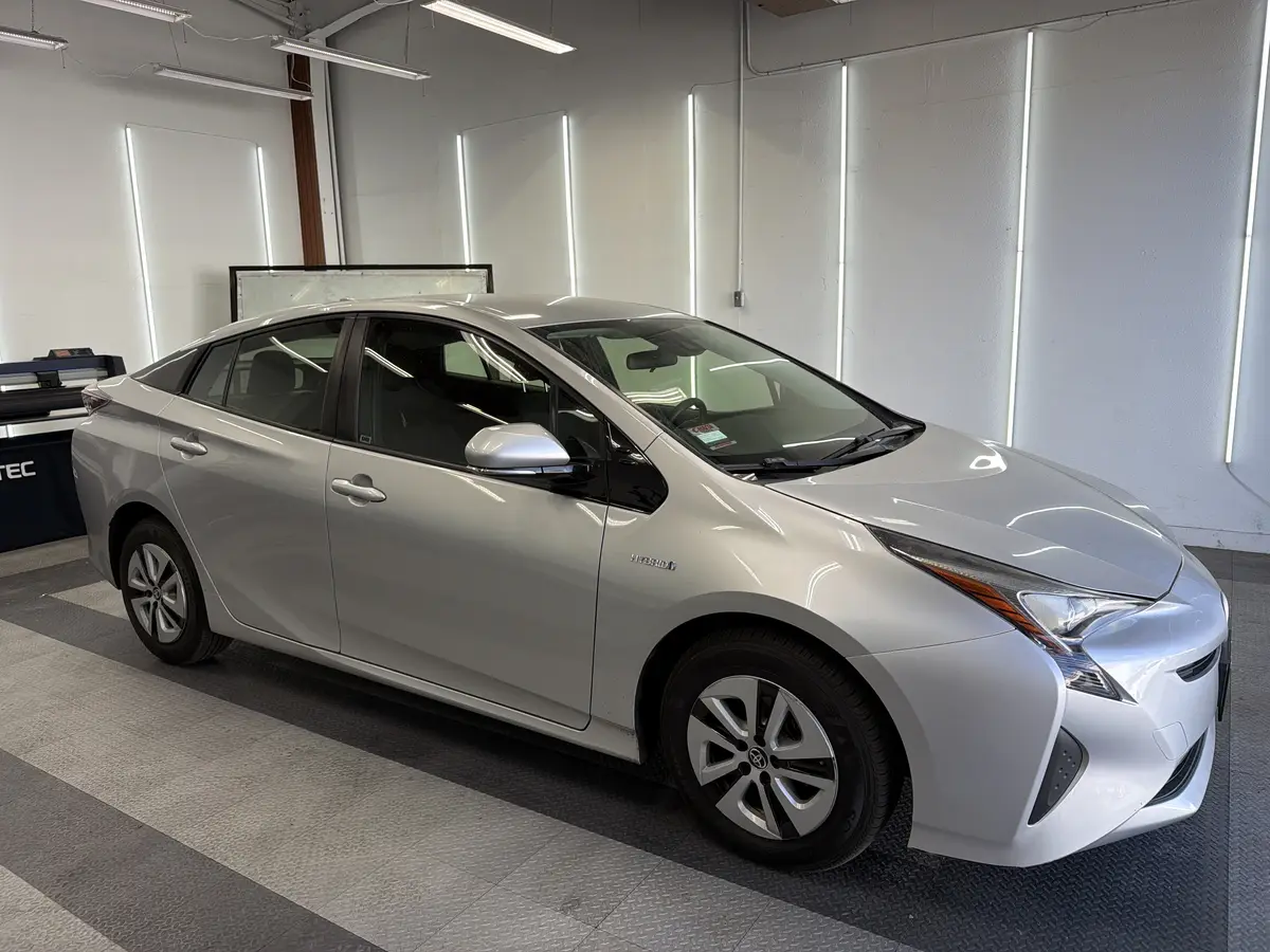 Silver Toyota Prius before window tinting, factory glass (view 1)