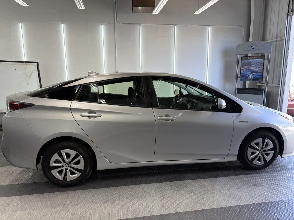 Silver Toyota Prius before window tinting, factory glass (view 2)