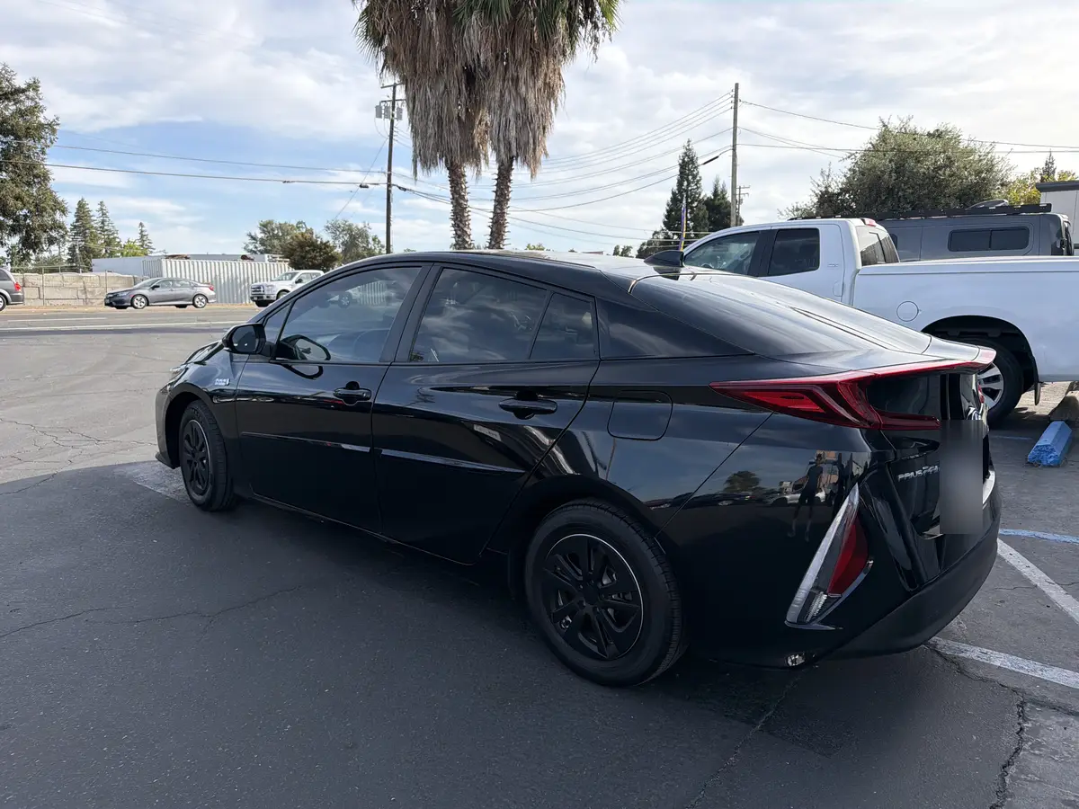 Black Toyota Prius Prime after Avery Dennison Encore Supreme ceramic window tint (view 1)