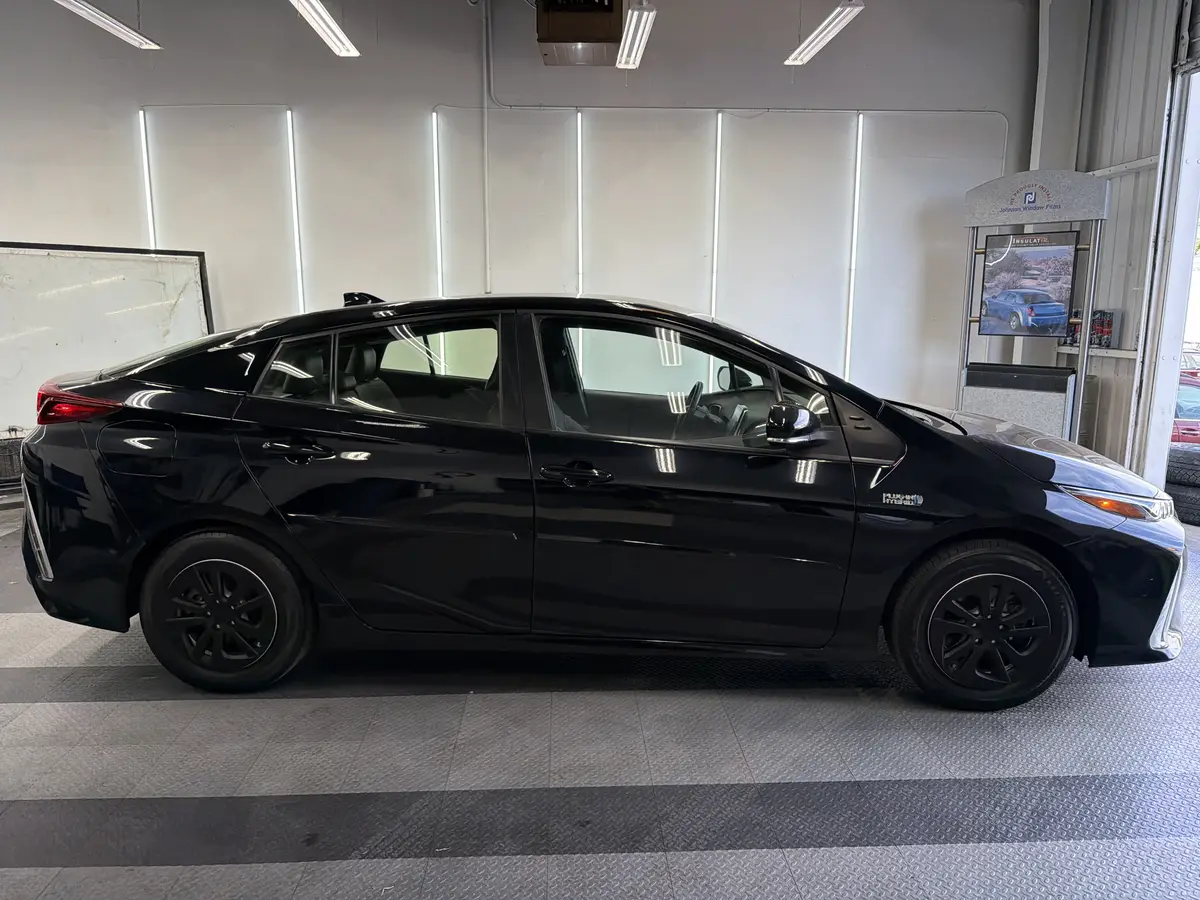 Black Toyota Prius Prime before window tinting, factory glass (view 2)