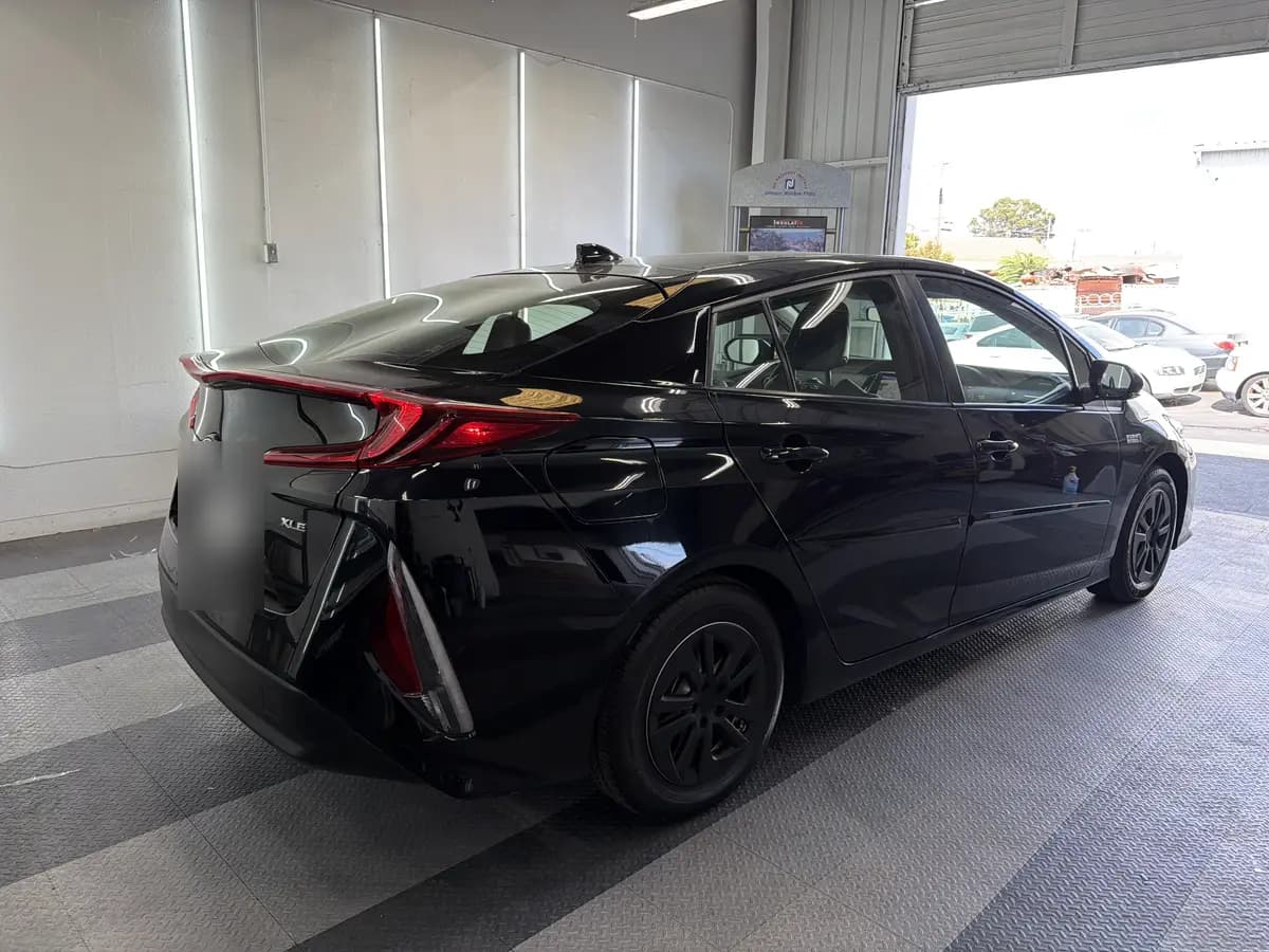 Black Toyota Prius Prime before window tinting, factory glass (view 3)