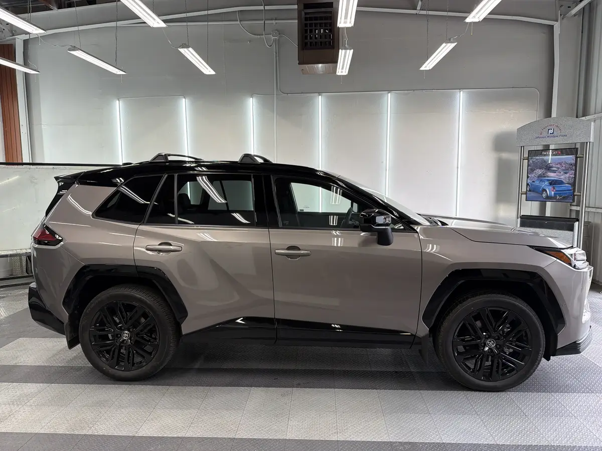 Gray Toyota RAV4 before window tinting, factory glass (view 2)