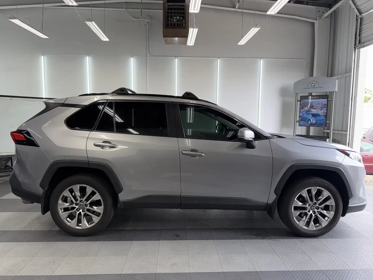 Silver Toyota RAV4 at Quality Window Tinting, carbon window tint job (photo 1)