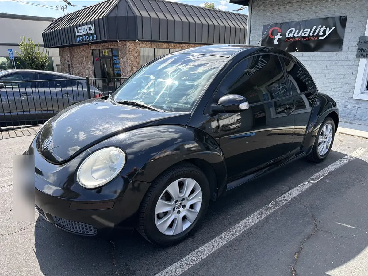 Black Volkswagen Beetle after Avery Dennison Encore Supreme ceramic window tint (view 1)