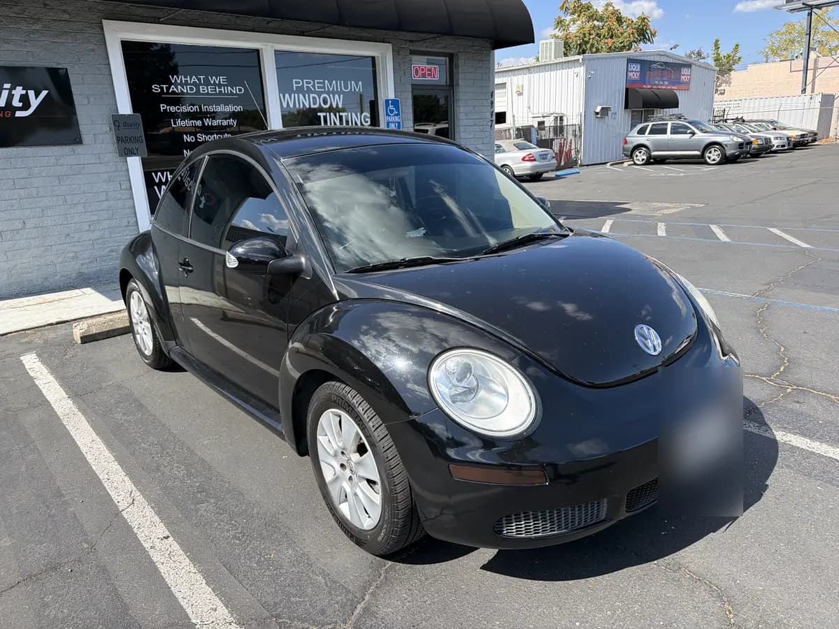 Black Volkswagen Beetle after Avery Dennison Encore Supreme ceramic window tint (view 2)